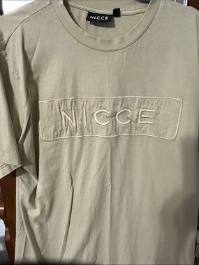 NICCE Mercury T-Shirt, lifestyle piece featuring prominent,embroidered box logo